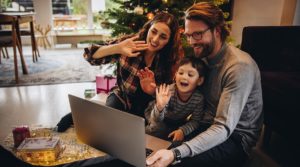 A family is on zoom during Christmas, possibly exposing themselves to cybersecurity threats during the holidays.